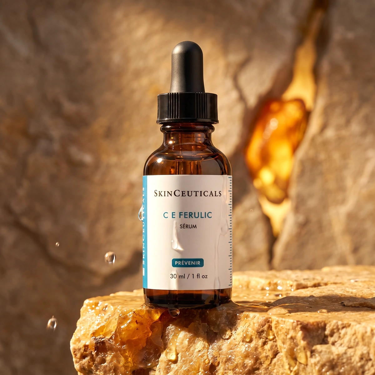 SkinCeuticals C E Ferulic bottle on dark warm stone, with a pale label and an amber highlight
